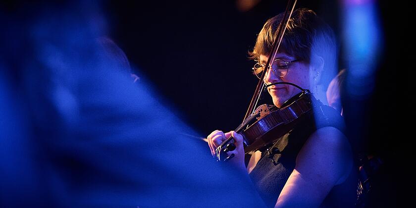 folkBALTICA ensemble member is playing the violin